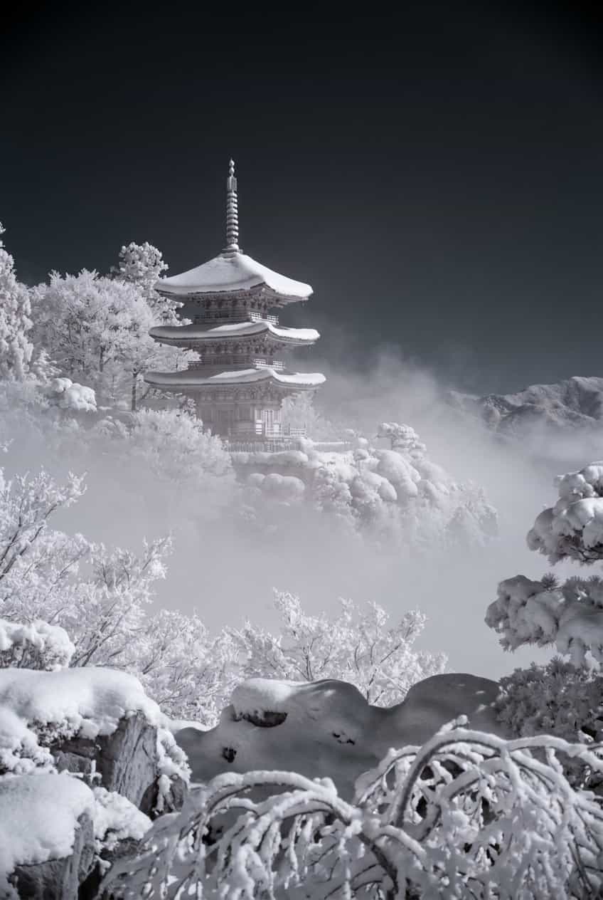Vintage ukiyo-e style poster of a Japanese pagoda covered in snow, printed on enhanced matte paper.
