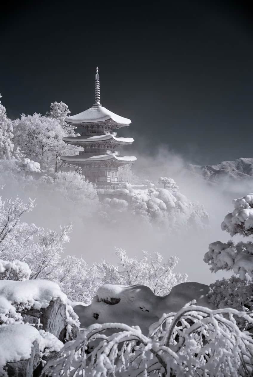 Vintage ukiyo-e style poster of a Japanese pagoda covered in snow, printed on enhanced matte paper.